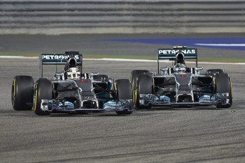 Lewis Hamilton (#44) fending off an attack from Nico Rosberg during the Bahrain GP