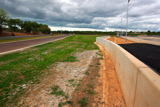 The new concrete wall and extended grass verge, as seen looking back towards Turn 1