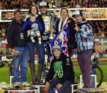 Chris Holder with his family, partner and son on the podium in Poland