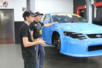 Morris shows Fullwood the inner workings of his race shop
