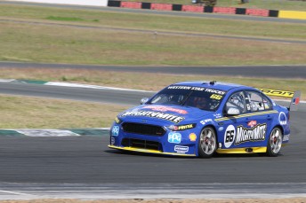 Fabian Coulthard tested the foot and leg protection tray at Queensland Raceway pic: Matthew Paul Photography