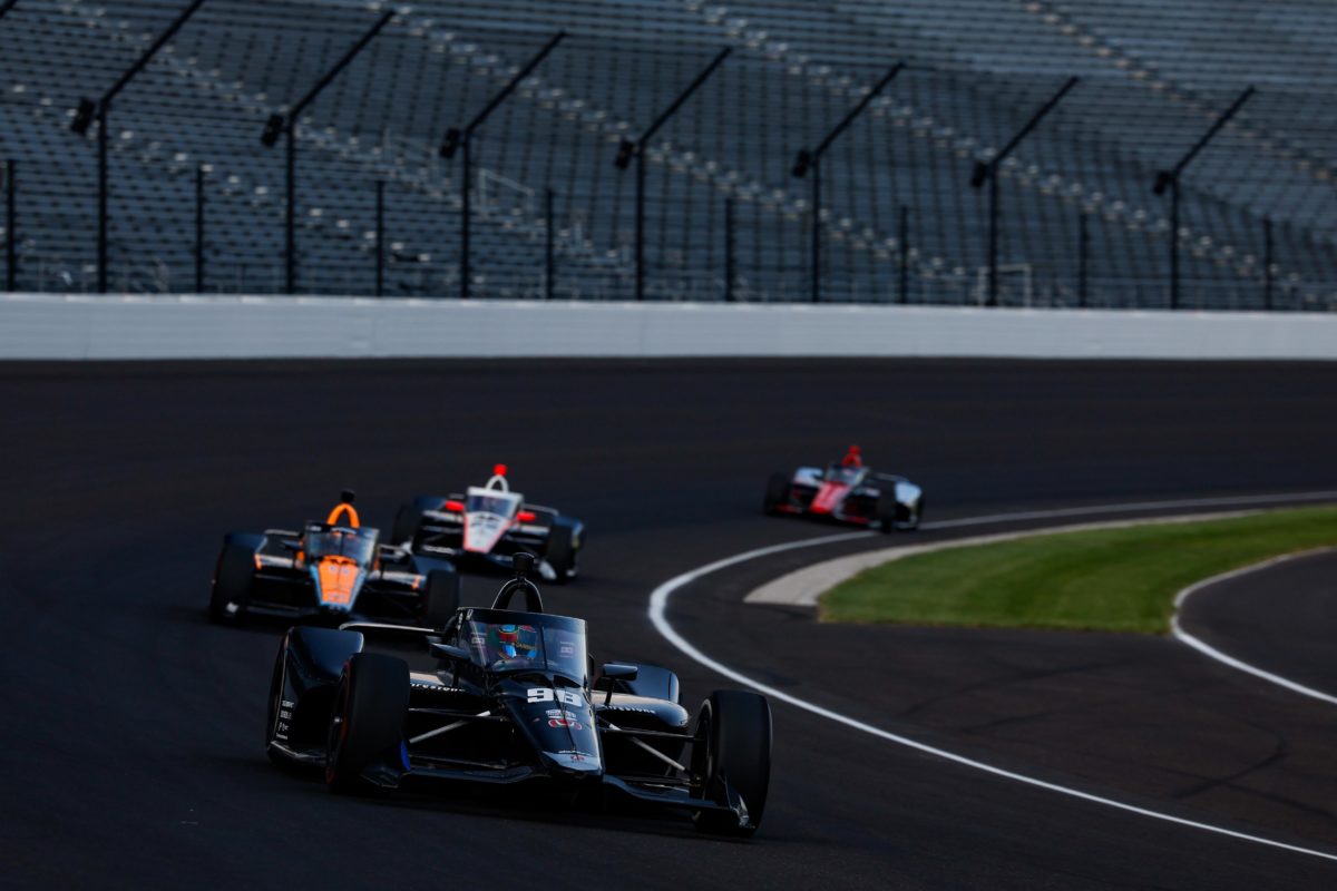 Several drivers testing the new hybrid engine components at the Indianapolis Motor Speedway.