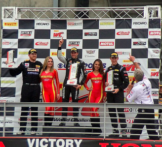 A jubilant James Davison (centre) after taking his maiden Pirelli World Challenge win