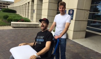 James Hinchcliffe checking out of hospital with assistance from Will Power on May 27