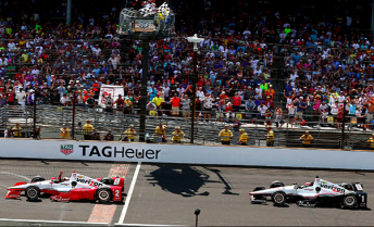 Juan Montoya flashes across the line of bricks to score his second Indy 500 win in a gripping finish from Will Power