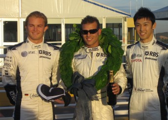 Justin Ruggier flanked by Nico Rosberg (left) and Kazuki Nakajima 