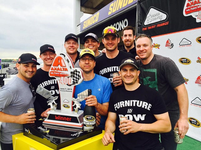 Peter Craik (Back right) celebrates with the Furniture Row team