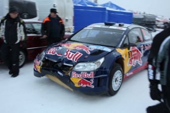 Raikkonen brings his damaged Citoen into service at the Arctic Rally