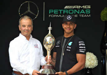 Lewis Hamilton collects the Hawthorn trophy from MSA boss Rob Jones