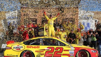 Logano celebrates in Kansas