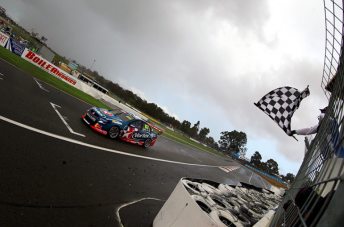 Craig Lowndes takes the flag in Race 8 at Barbagallo Raceway