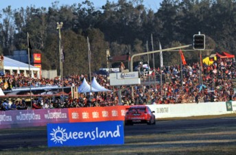 Craig Lowndes crosses the line to win Race 16 of the V8 Supercars Championship at Queensland Raceway yesterday