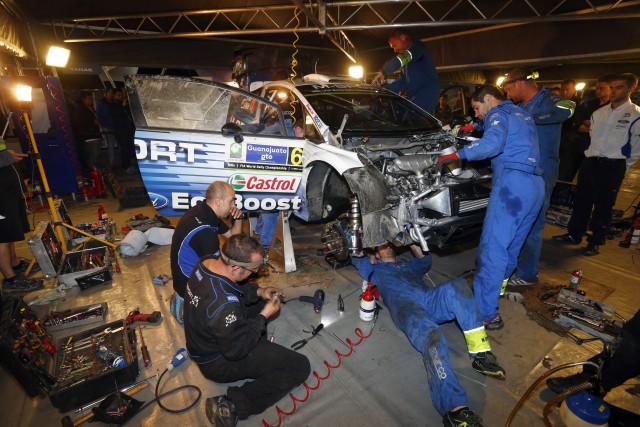 The M-Sport crew begin the monster task of fixing the sodden Fiesta