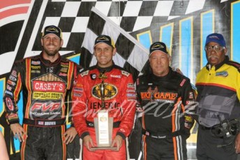 Kerry Madsen (2nd left) is flanked by Brian Brown (L - 3rd), Sammy Swindell (R - 2nd) and a Knoxville Raceway official after his Outlaws win