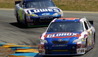 Marcos Ambrose leads Jimmie Johnson at Sonoma last weekend