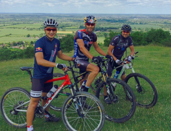 Webber, a keen cyclist, pictured here with protege Mitch Evans and friend Richard Connor