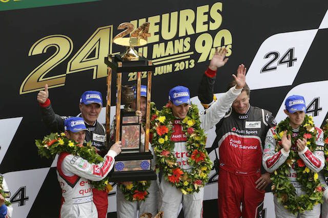Allan McNish (left) won his third Le Mans 24 Hour alongside Tom Kristensen and Loic Duval in 2013 (GB), Dr. Wolfgang Ullrich (Head of Audi Sport), Tom Kristensen (DK), Ralf Jüttner (Technical Director Audi Sport Team Joest), Loïc Duval (F) on the podium of the 24h of Le Mans