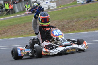 Jason Hryniuk crossing the line for his third consecutive Clubman Heavy championship. Pic: Cooper