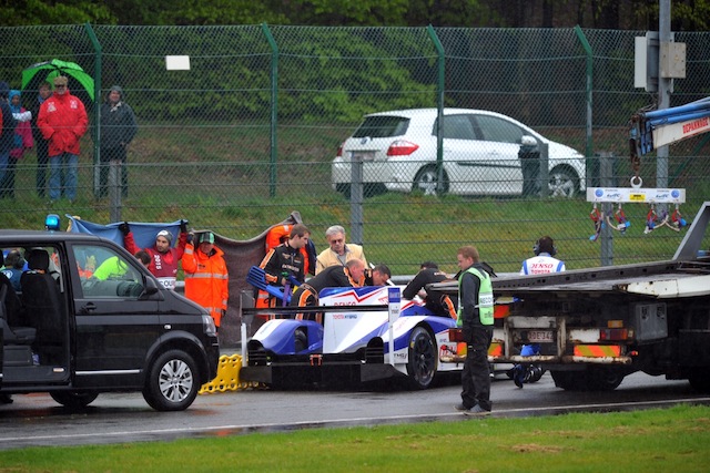 Officials come to the aid of Nakajima after he slammed into the back of the #8 Audi at Spa