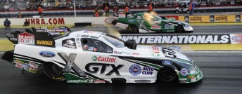 John Force (far lane) defeated Mike Neff in the Funny Car Winternationals Final