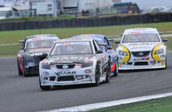 Peter Carr leads the tight pack at Phillip Island