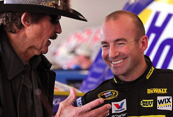Marcos Ambrose shares a laugh with team owner Richard Petty at Daytona