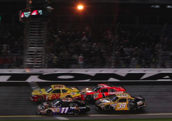 Jamie McMurray (#1) bumped Kurt Busch (#22) to the win in the Shooutout