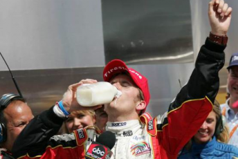 Dan Wheldon drinking from the Indy 500 milk bottle that was to live at Anderson