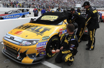 Marcos Ambrose will have a new car at Martinsville this weekend