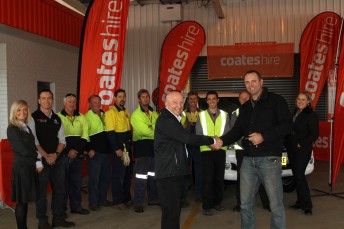 Pim Kaye (R) receives the keys to his new HiLux from CEO of Coates Hire, Leigh Ainsworth as the Coates Hire Ballina Staff watch on