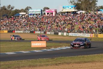 Jamie Whincup on the way to victory at Queensland Raceway in August