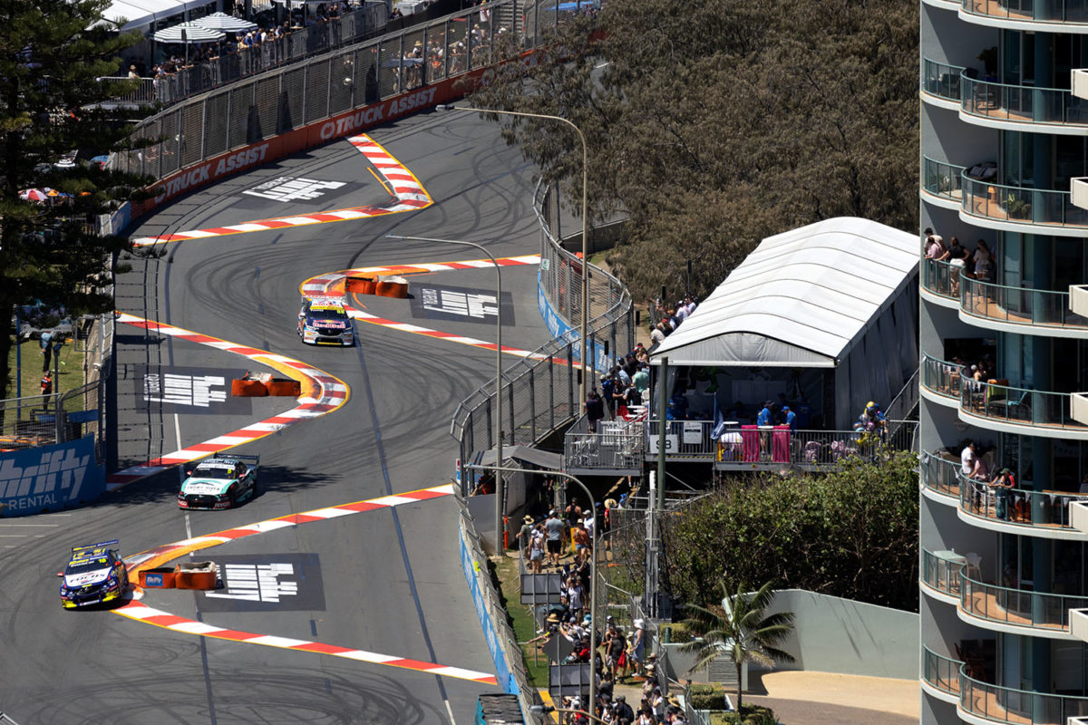 Three Supercars drive through the Beach Chicane on the Gold Coast in 2022, when the complex featured tyre bundles