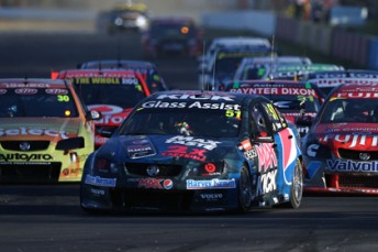 thumb Pepsi Max Crew driver Jacques Villeneuve leads a pack of V8 Supercars at Queensland Raceway