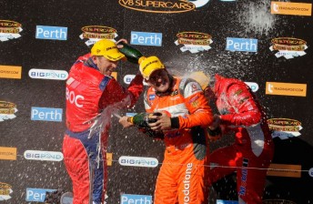Bright (left), Whincup and Tander celebrate after Race 9