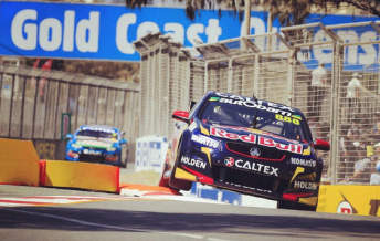 The #888 Red Bull Holden attacking the Surfers kerbs