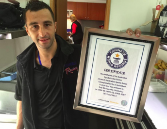 Tony Ricciardello with his Guinness world record certificate for most Sports Sedans title after scoring eighth in 2014 