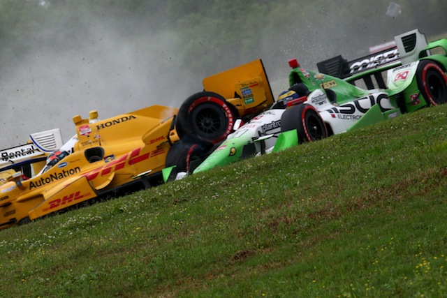Ryan Hunter-Reay slams into Sebastien Bourdais in a three-car melee for which he was penalised following the New Orleans race