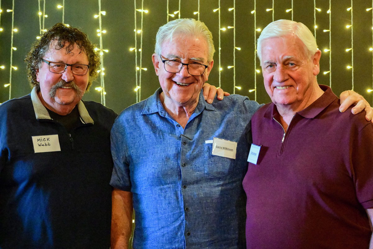 Former Seven Network commentator Garry Wilkinson (centre, with Mick Webb left of frame and Dick Johnson right) has been inducted into the Supercars Media Association Hall of Fame. Image: Richard Gresham