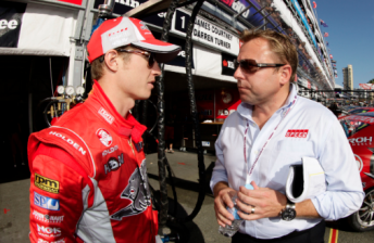 Australian race caller Leigh Diffey (right) speaks with Ryan Briscoe on the Gold Coast in 2011