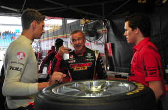 thumb Russell Ingall (centre) speaking with Walkinshaw Racing
