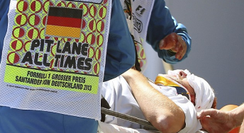 Paul Allen shortly after being struck by a flying wheel which came off Mark Webber