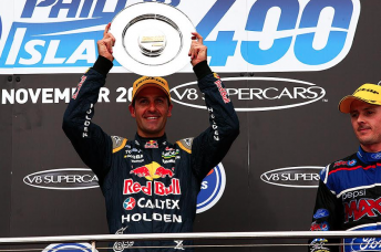 Jamie Whincup celebrates victory in race 34 which secured him a sixth V8 Supercars title  