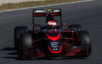 Jenson Button driving the new liveried Mclaren