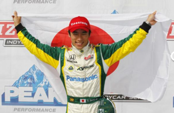 Takumo Sato celebrates his pole position