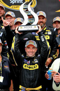 Marcos Ambrose celebrates his maiden NASCAR win with his team-mates