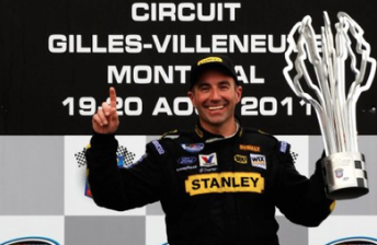 Marcos Ambrose celebrates his win this morning