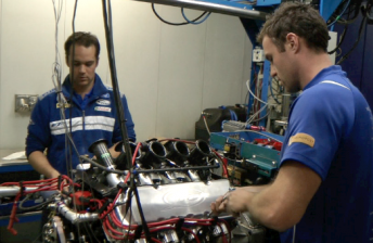 Justin Way and Jake Dempsey work on an FPR engine at the team