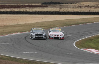 Todd Kelly and Fabian Coulthard vie for position at Symmons Plains yesterday