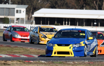 Chris Smerdon leads the V8 Touring Car pack at Winton