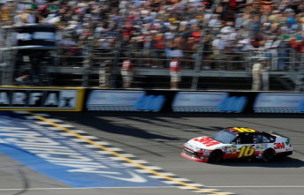 Greg Biffle cosses the line to at Michigan